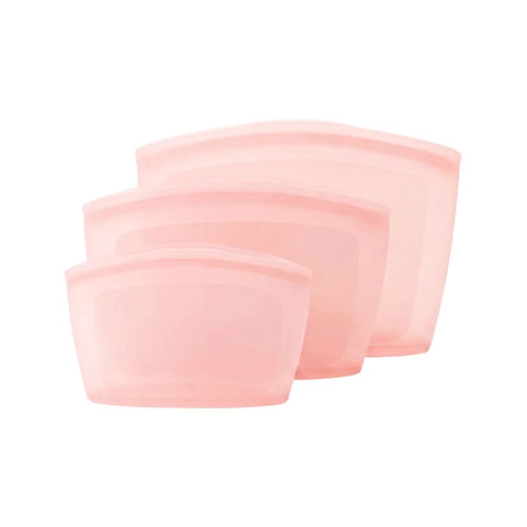 Set of three pink silicone pouches on a white background