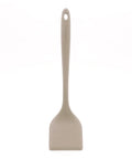 Beige spatula with a handle on a white background