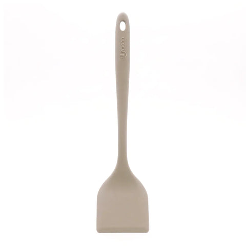 Beige spatula with a handle on a white background