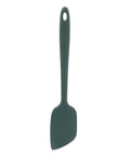 Dark green silicone spatula on a white background