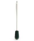 Cleaning brush with a white handle and green bristle head on a white background