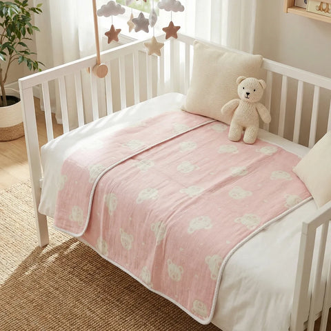 Crib with pink blanket and teddy bear in a nursery setting