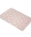 Pink mat with white pattern on a white background