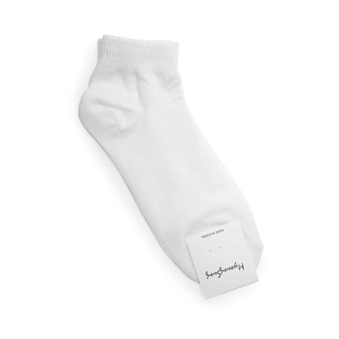 White ankle sock with a brand label on a white background