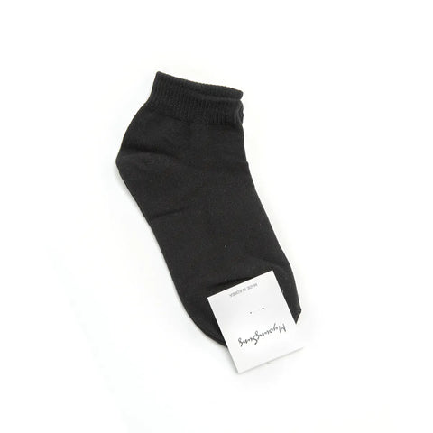 Black sock with a brand label on a white background