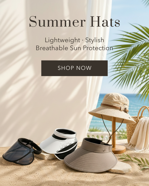 A promotional banner for summer hats featuring three sun visors and a bucket hat displayed on a sandy beach set with a white drape, palm leaves, and the ocean in the background. Text overlays read 'Summer Hats', 'Lightweight - Stylish Breathable Sun Protection', and 'SHOP NOW'.