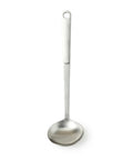 Stainless steel ladle on a white background.