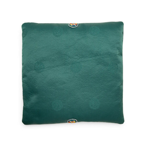Green seat cushion with an embroidered pattern on a white background