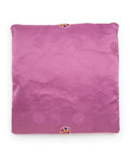 Purple textured square seat cushion with an embroidered design on a white background