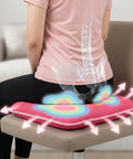 Person sitting on a chair with a pink seat cushion, showing a digital overaly of spine and pelvis, highlighting spinal health