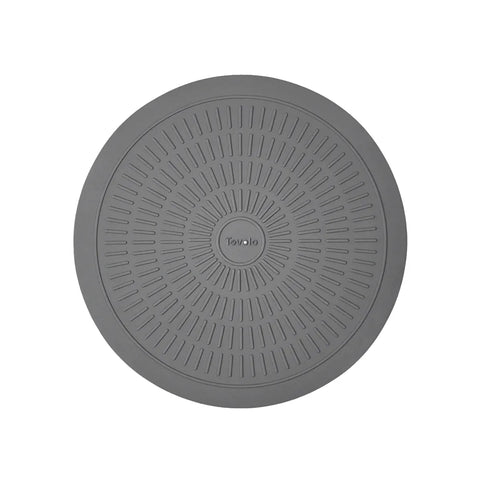 Gray round mat with textured surface on a white background