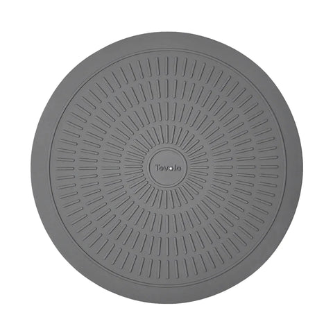 Round gray mat with textured surface and 'Tovolo' branding on a white background