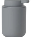 A matte gray cylindrical container with a matching gray screw-on lid and small side tab, shown on a plain white background.