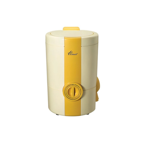 A retro-style electric moisture remover in cream and yellow, featuring a vertical yellow stripe, a top handle, and a front dial switch, shown on a plain white background.