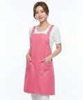 Woman wearing a pink apron on a white background