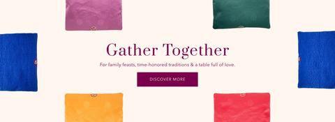 A banner showing colorful square floor cushions and a heading that says 'Gather Together - For family feasts, time-honored traditions & a table full of love. Discover More'