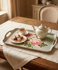 Tea set with a floral tray on a wooden table