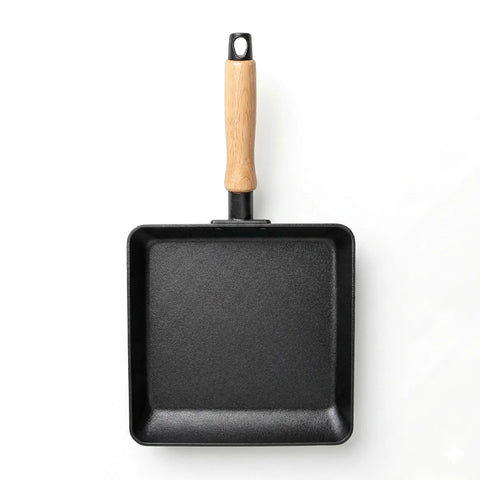 Black square frying pan with a wooden handle on a white background