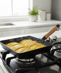 Frying pan with omelette on a stove in a kitchen setting