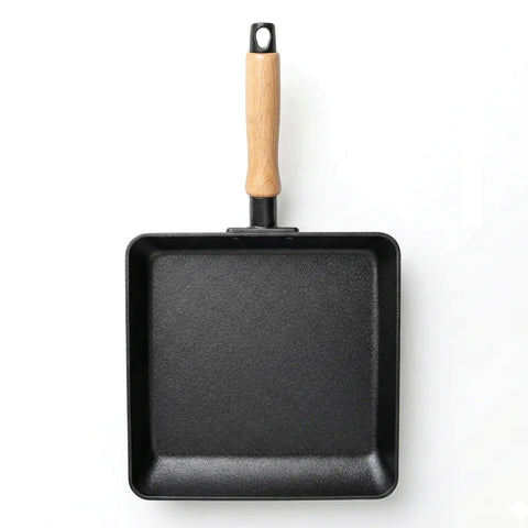 Black square frying pan with a wooden handle on a white background
