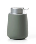 Matte green soap dispenser with silver pump on a white background