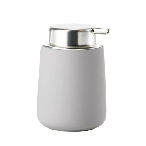 A modern cylindrical pump dispenser with a matte light gray body and a polished silver stainless steel pump head, shown on a solid white background.
