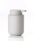Light gray soap dispenser on a white background