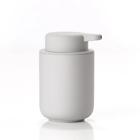Light gray soap dispenser on a white background