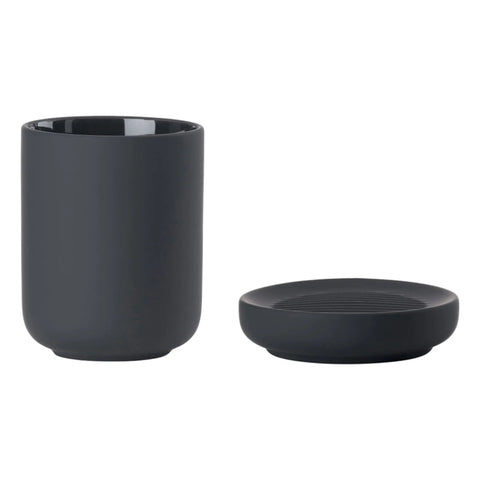 Black toothbrush mug and soap dish on a white background.