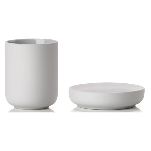 Light gray ceramic cup and soap dish on a white background