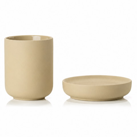 Beige ceramic cup and soap dish on a white background