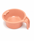 A peach-colored plastic measuring cup with a handle, shown on a clean white background.