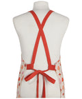 Red apron on a mannequin with a white background