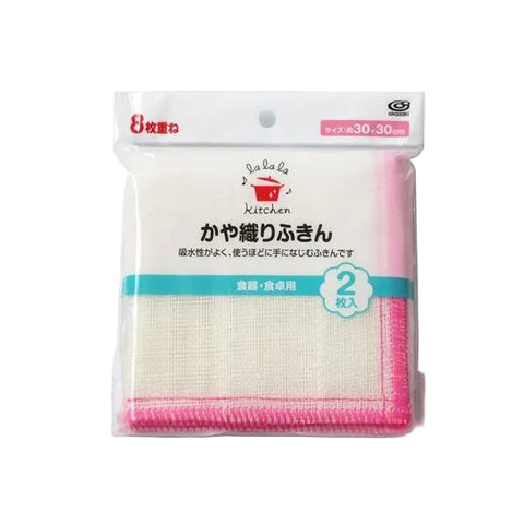 Packaged kitchen cleaning cloth set in Japanese, showing a white mesh cloth with pink stitched edges inside a clear plastic bag with printed branding and product details.