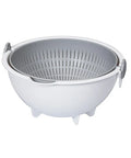 A white plastic colander bowl with a gray perforated inner strainer basket, shown on a plain white background.
