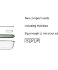 Clear salad bowl with two compartments and a mini box on a white background